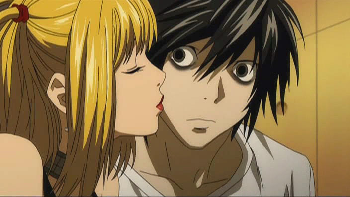 misa-gives-L-a-peck[1]